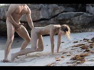 Extreme art sex of sleek couple on beach