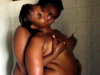 Horny african sistas share the shower in this amateur scene
