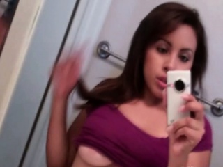 Busty teen hottie shows her big tits while taking selfie