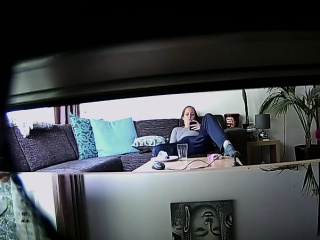 Peeping Tom Uses A Hidden Cam To Spy On A Brunette Lounging...