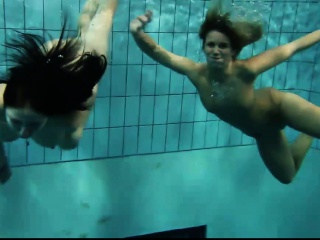 Two Sexy Amateurs Showing Their Bodies Off Under Water...