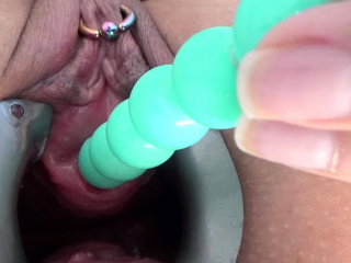 Female masturbate her pee hole with a huge dildo of balls