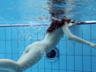 Roxalana submerged in the pool naked