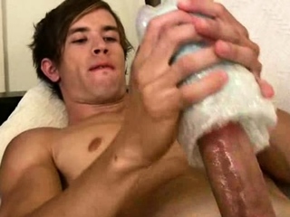 Sexy gay boy filmed close-up while testing his new toy