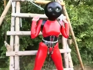 Hot outdoor action with latex fetish