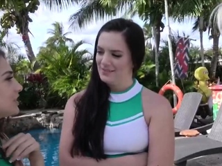 Cheerleaders poolside in foursome...