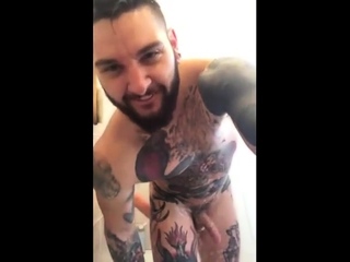 Tatted hunk fucks dildo in shower...