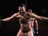 Greg takes a flogger to Vanders bound cock