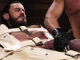 Greg Dixxon taunts Vander Pulaski by sucking his bound cock