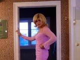 Blonde Crossdresser Strips Out of a Pink Mini Dress